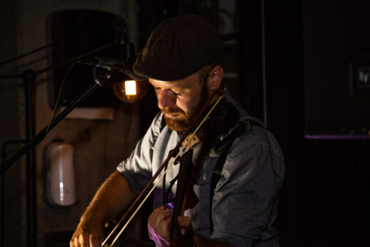 the innovative accoustic artist playing his fiddle