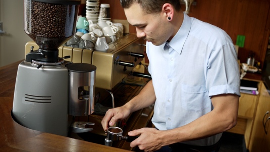 Image of Richard Legg dosing an espresso handle.