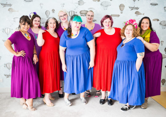 group of fat women in super comfy knit dresses