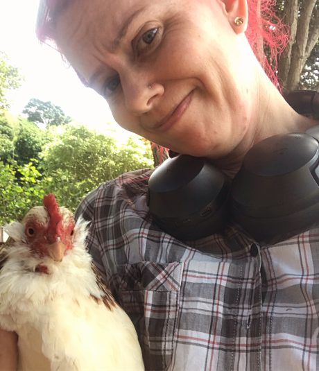 Zoe cuddles a chicken